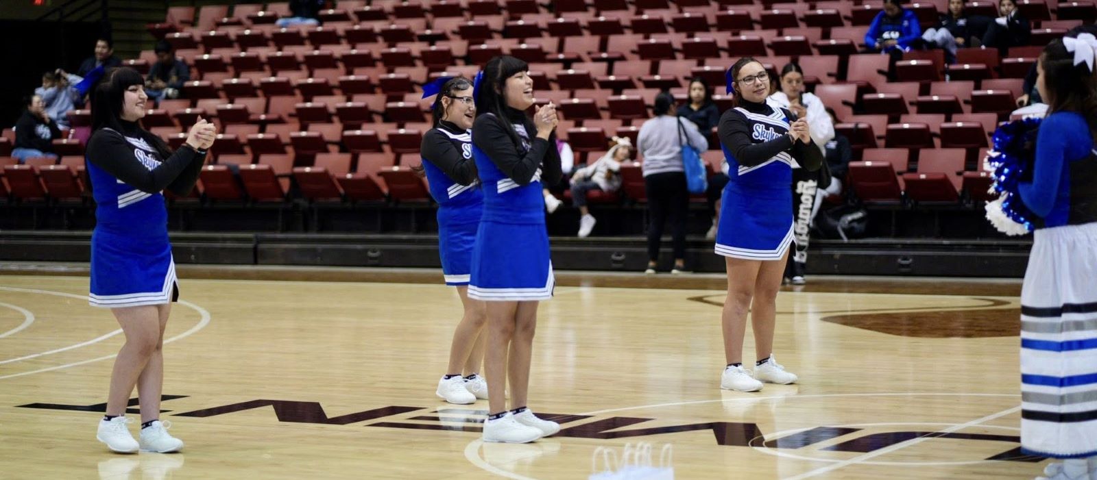 Takini Skyhawks cheerleaders on the court
